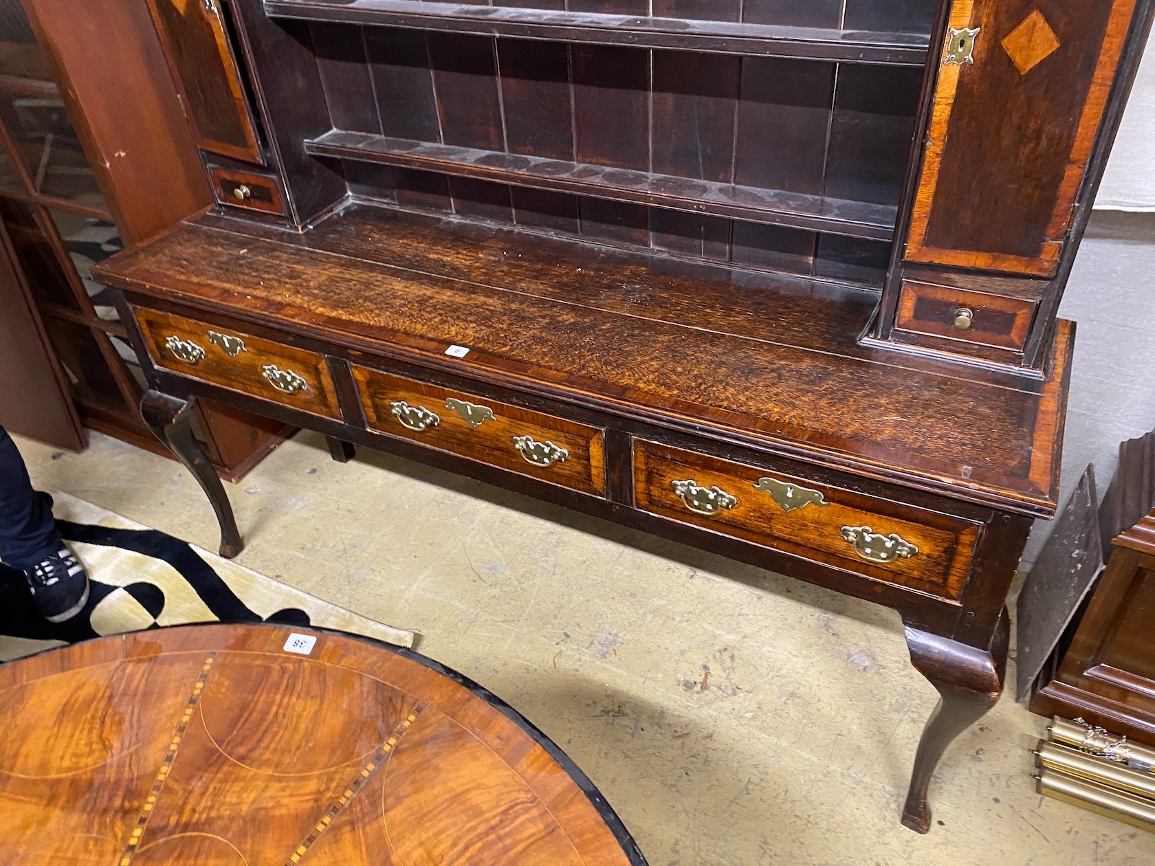 A George III style banded oak dresser, with boarded rack, width 163cm, depth 44cm, height 198cm